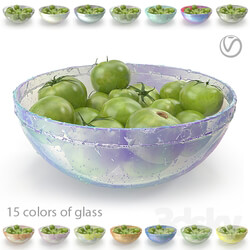 Green tomatoes in a round glass plate 15 colors of glass with drops of water and without  