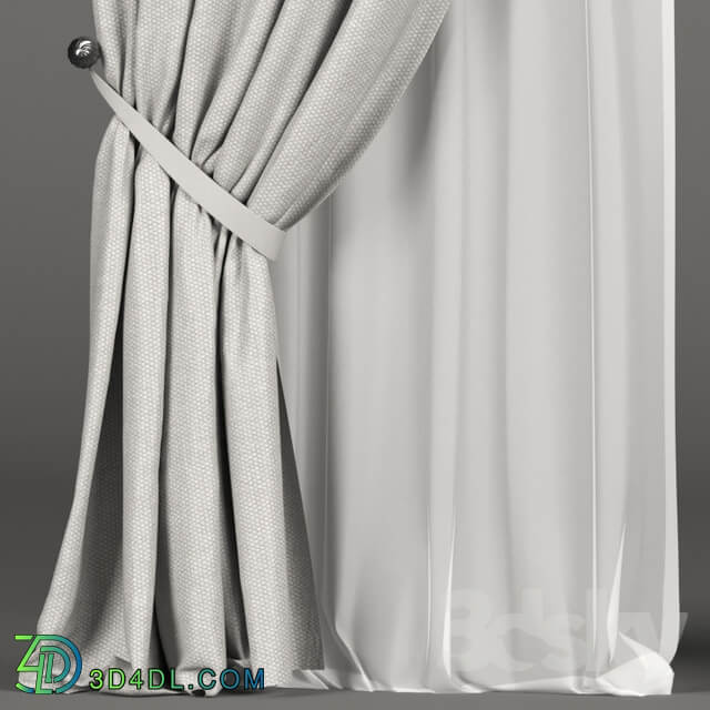 White curtains in the background with tulle and a Roman curtain.