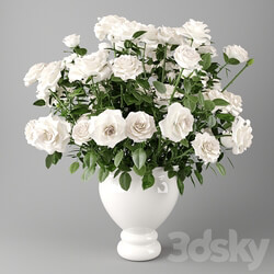 White roses in a white vase Bouquet of white roses in a white vase 