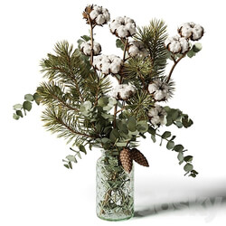 Bouquet of eucalyptus pine and cotton in a glass vase 