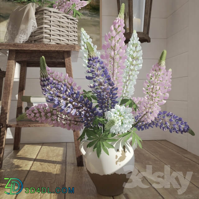Decorative set of objects with a bouquet of lupine