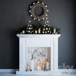 Artificial fireplace with candles and Christmas decorations 