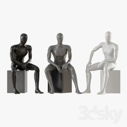 Three seated faceless mannequins 13 