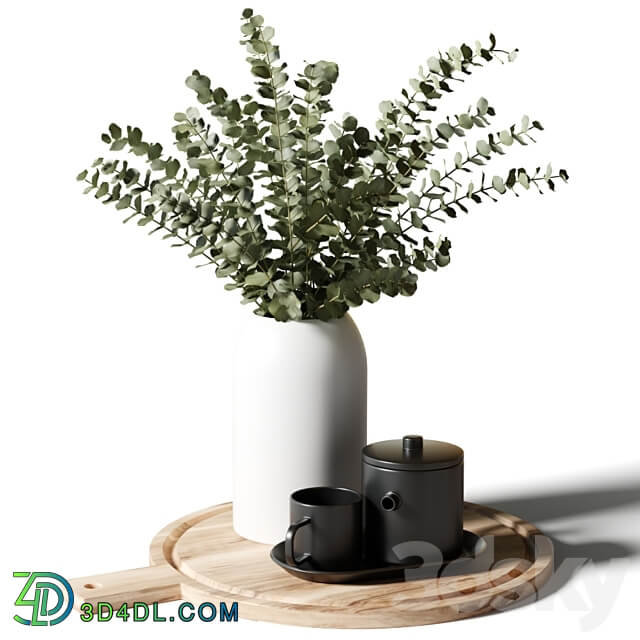 A bouquet of eucalyptus in a white vase and a teapot with a cup on a wooden board