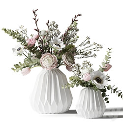 Two bouquets in white ribbed vases 