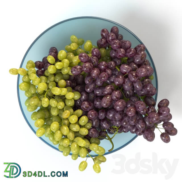 Bunches of grapes in a glass bowl