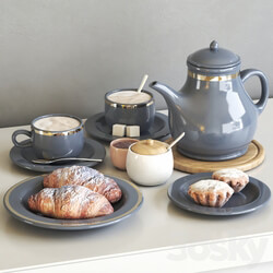 Tea set with croissant and muffin 