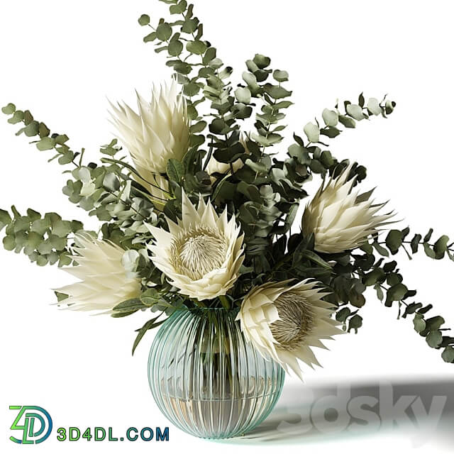 Bouquet with white proteas and eucalyptus in a ribbed glass vase