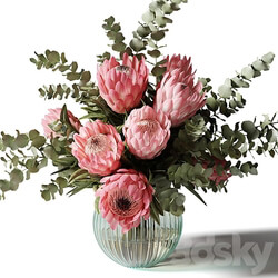 Bouquet with pink proteas and eucalyptus in a ribbed glass vase 