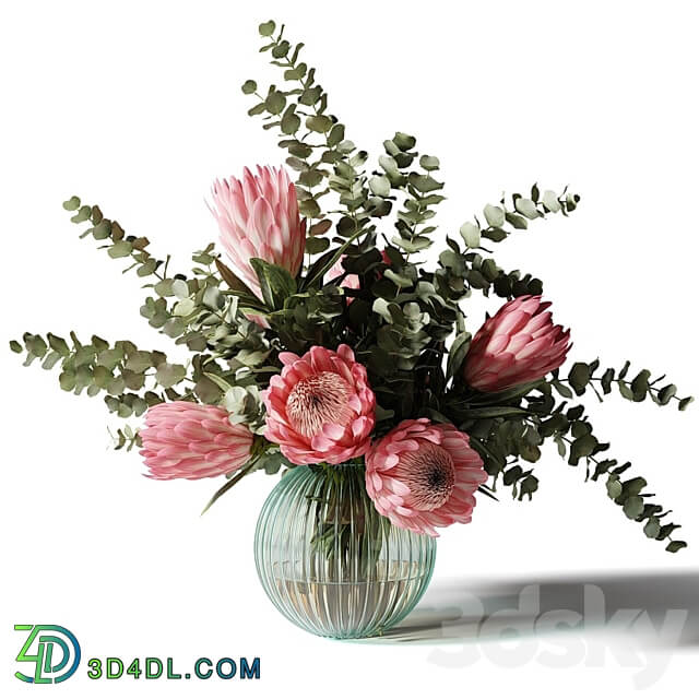 Bouquet with pink proteas and eucalyptus in a ribbed glass vase