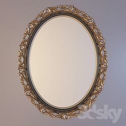 oval mirror in a carved frame 