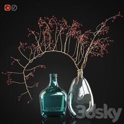 Decorative branch with red berries in a glass vase 