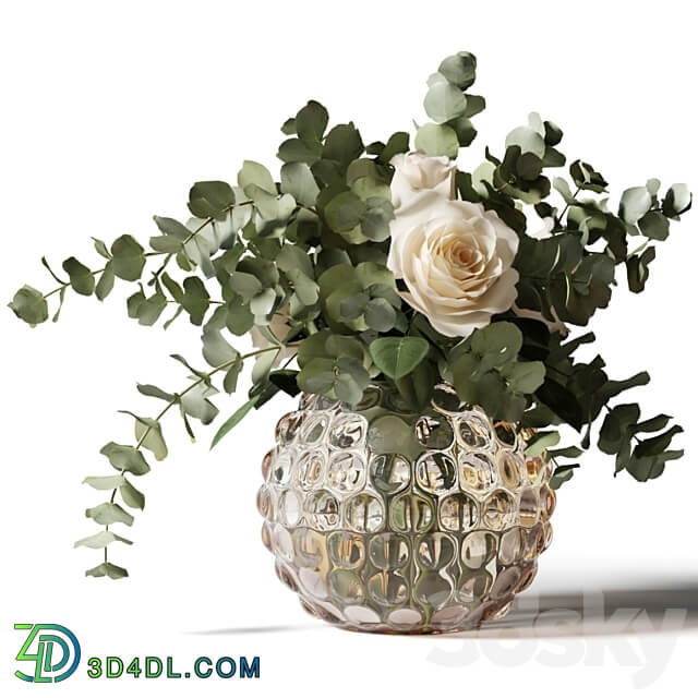 Bouquet of roses and eucalyptus in a glass pimpled vase