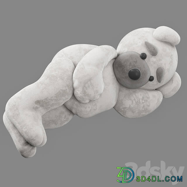 soft toy bear lies on its side