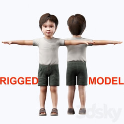 Boy in a T shirt and shorts. 